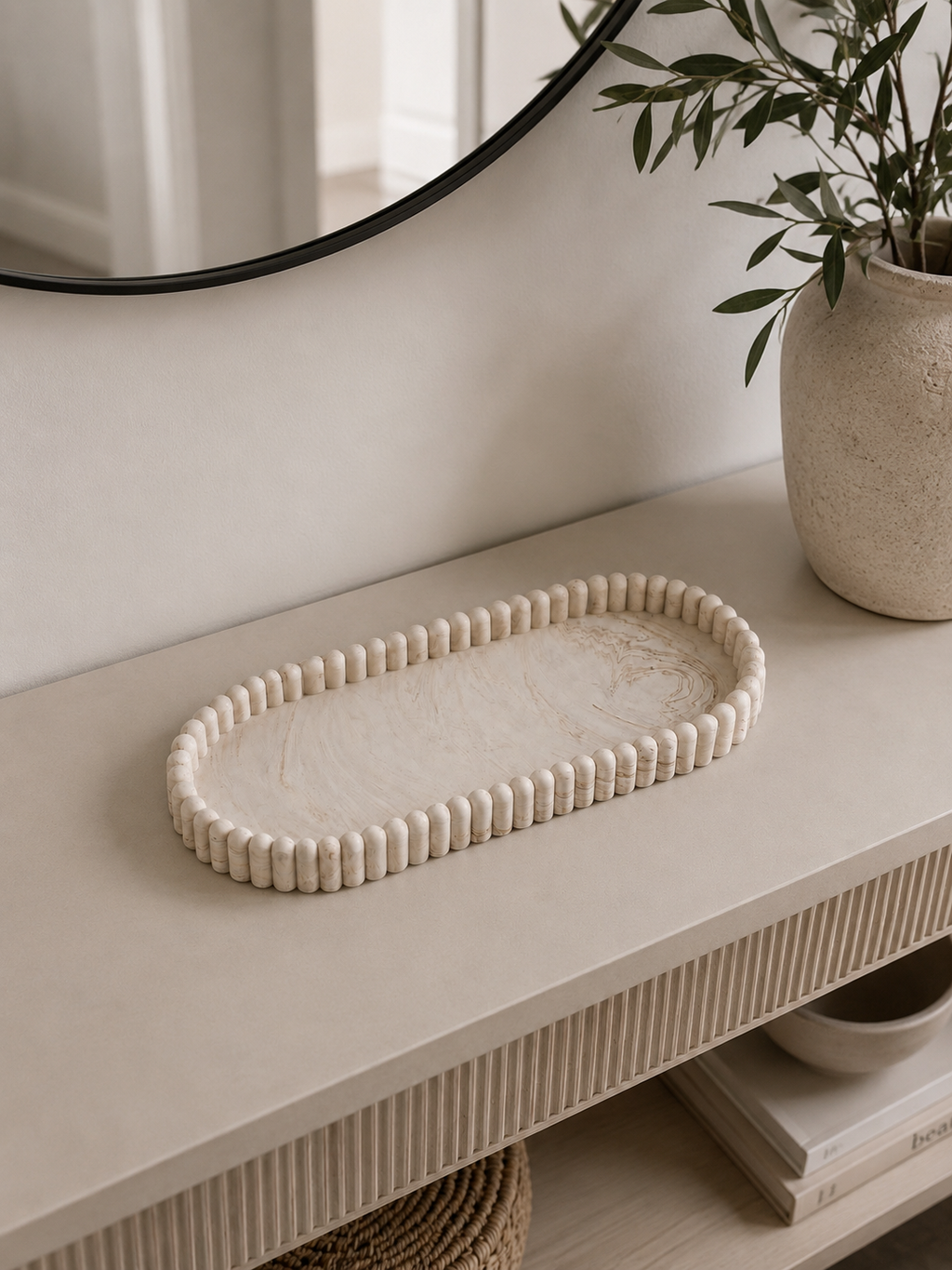 Aurea ribbed oval decorative tray styled on a modern neutral entryway console