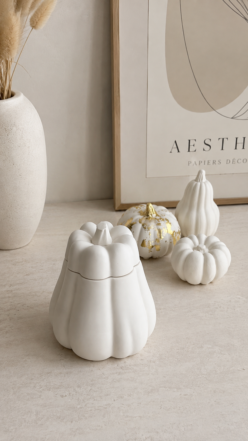 Decorative pumpkin storage pot styled with neutral autumn home decor