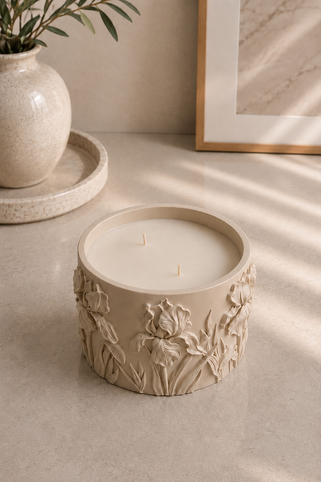 Beige Iris floral candle in a sculptural Jesmonite vessel for neutral home decor