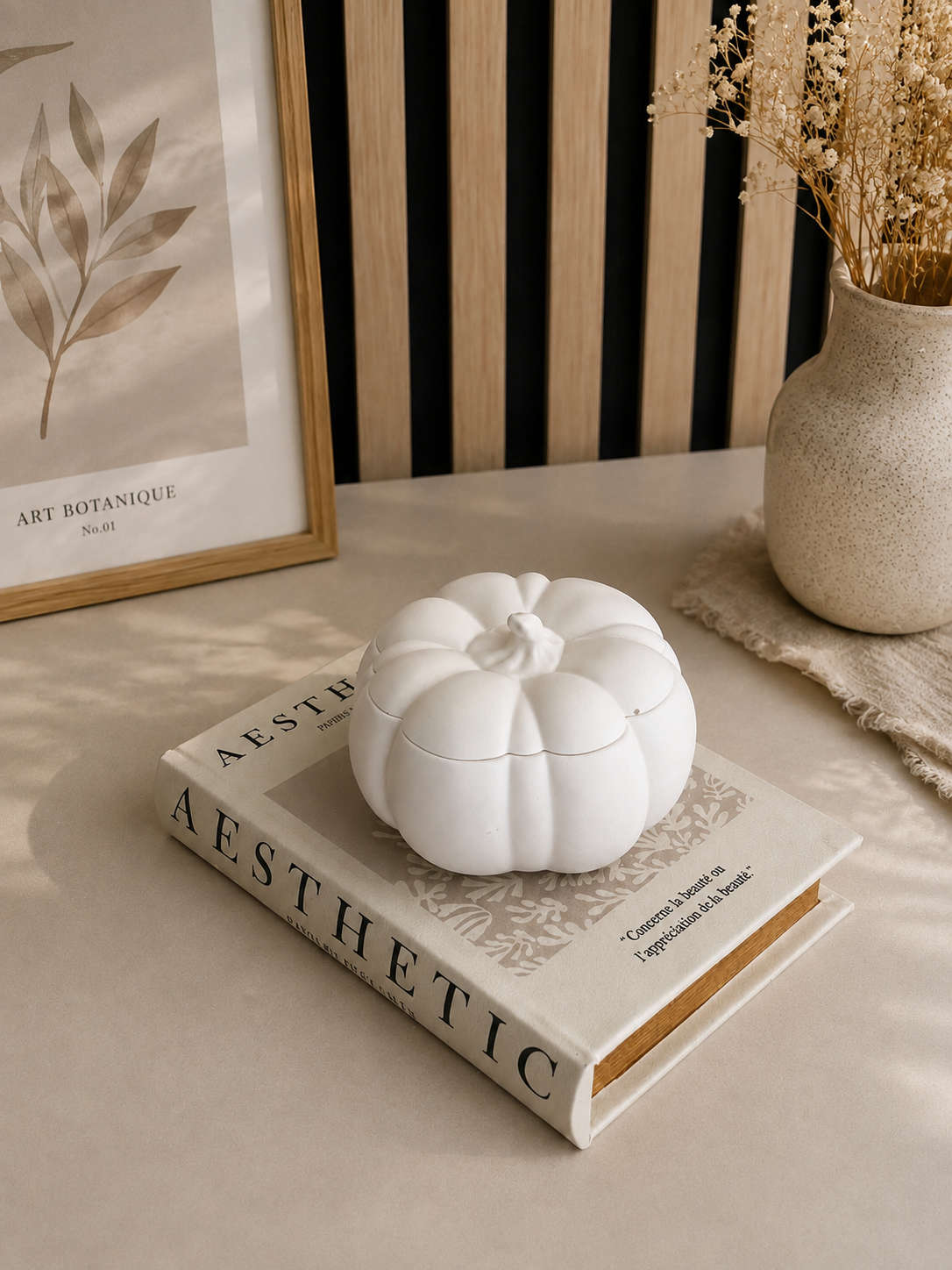 White sculptural pumpkin candle with matching decorative lid