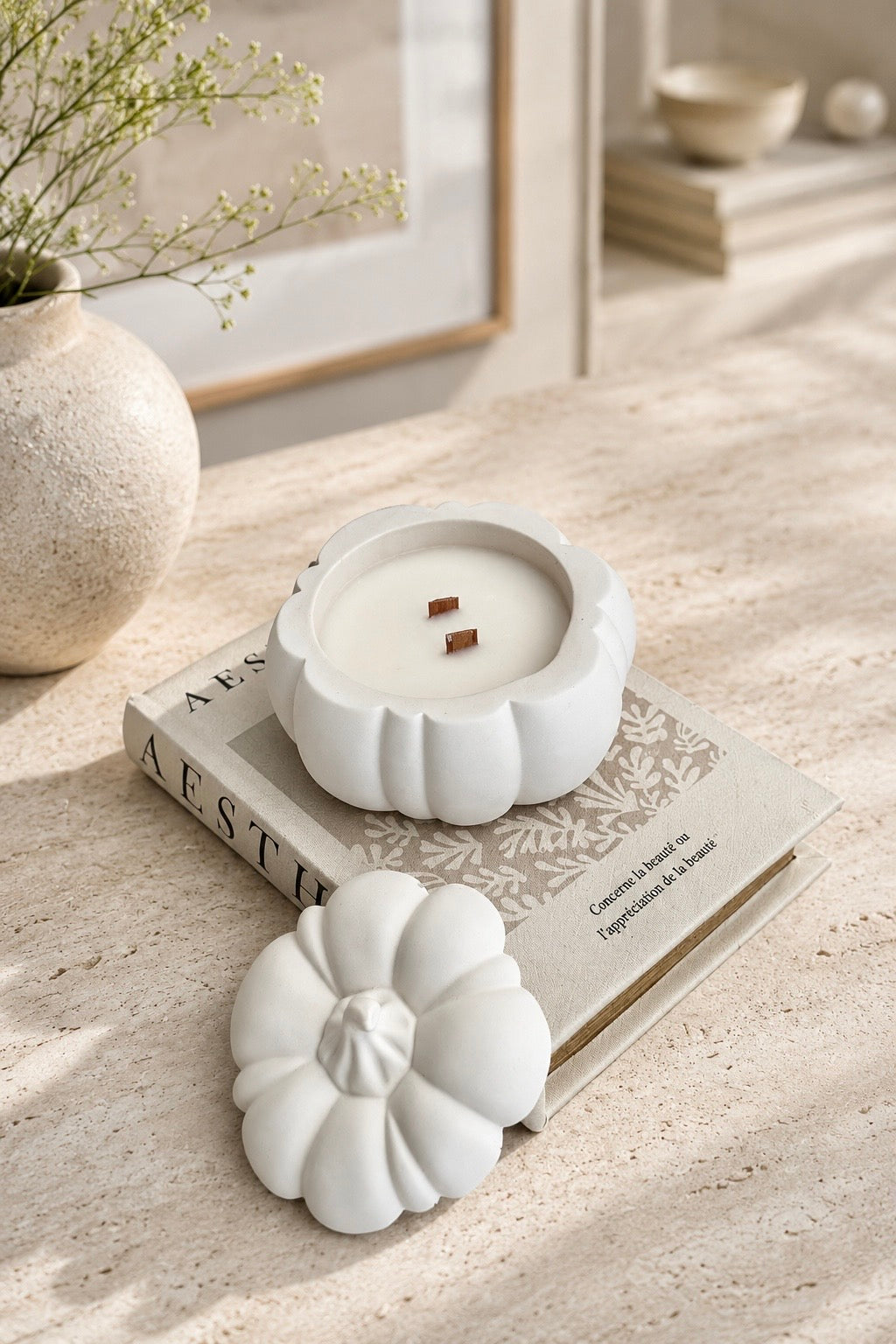 White pumpkin candle with two wooden wicks and matching Jesmonite lid