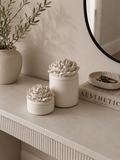 Handcrafted Jesmonite peony flower storage pot with removable floral lid styled on a modern neutral entryway console.