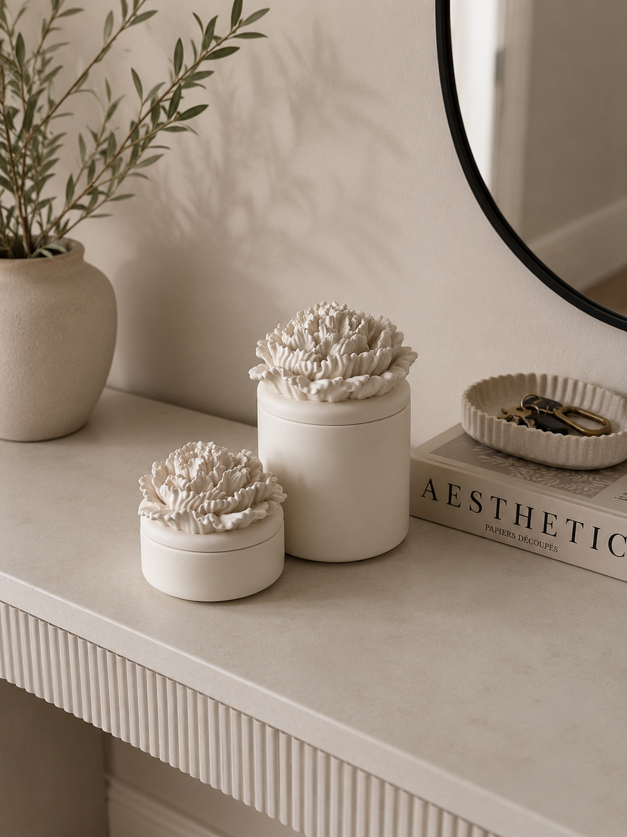 Handcrafted Jesmonite peony flower storage pot with removable floral lid styled on a modern neutral entryway console.