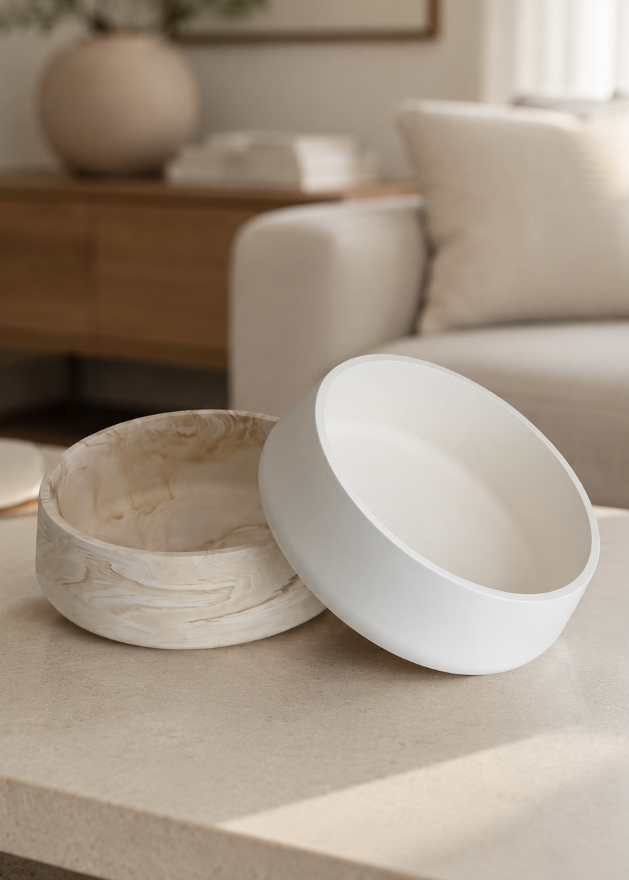 Close-up of the Solea marble beige decorative bowl showing its rounded organic shape and unique hand-cast pattern.