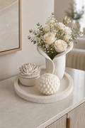 Handcrafted ribbed round decorative tray styled on a modern console table with candles, jewellery and neutral home décor accessories.